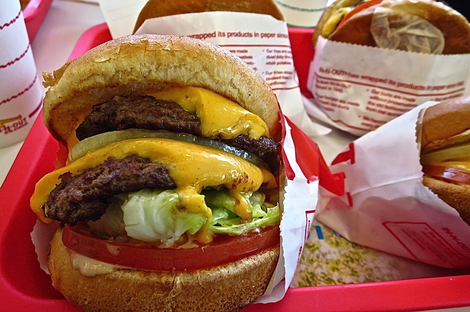 In-n-Out Burger signature dishes  Double-Double Burger, Animal Style Fries, Cheeseburger, various milkshakes.