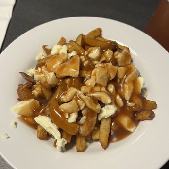 Restaurant Poutineville Saint-Roch signature dishes Create Your Own PoutineThe Filet Mignon PoutineThe Poutineville PoutineThe Hangover Poutine