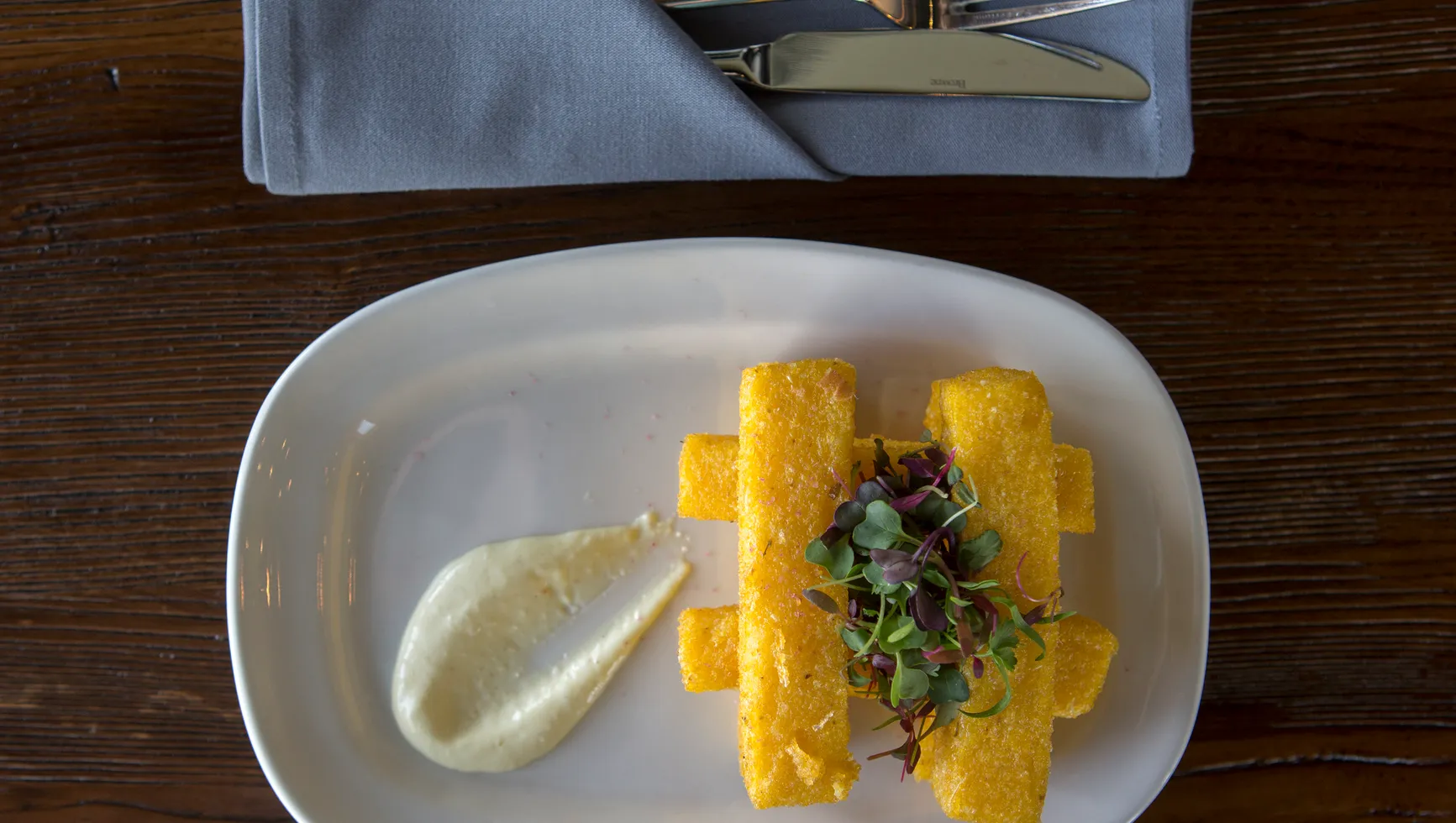 Cuvee Wine Table signature dishes Chicken Schnitzel, Cheese Board, Polenta.