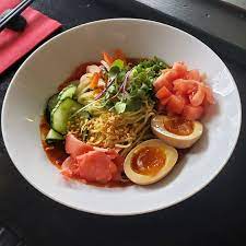 Tanoshii Japanese Restaurant signature dishes Tanoshii Ramen, Spicy Tuna Roll, Big Sky Roll, Gyoza