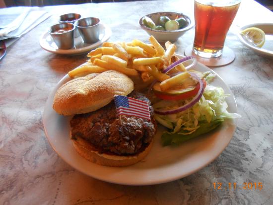 The Log Cabin Bar and Grille signature dishes Bison Burger, Elk Medallions, Fried Chicken, Rainbow Trout