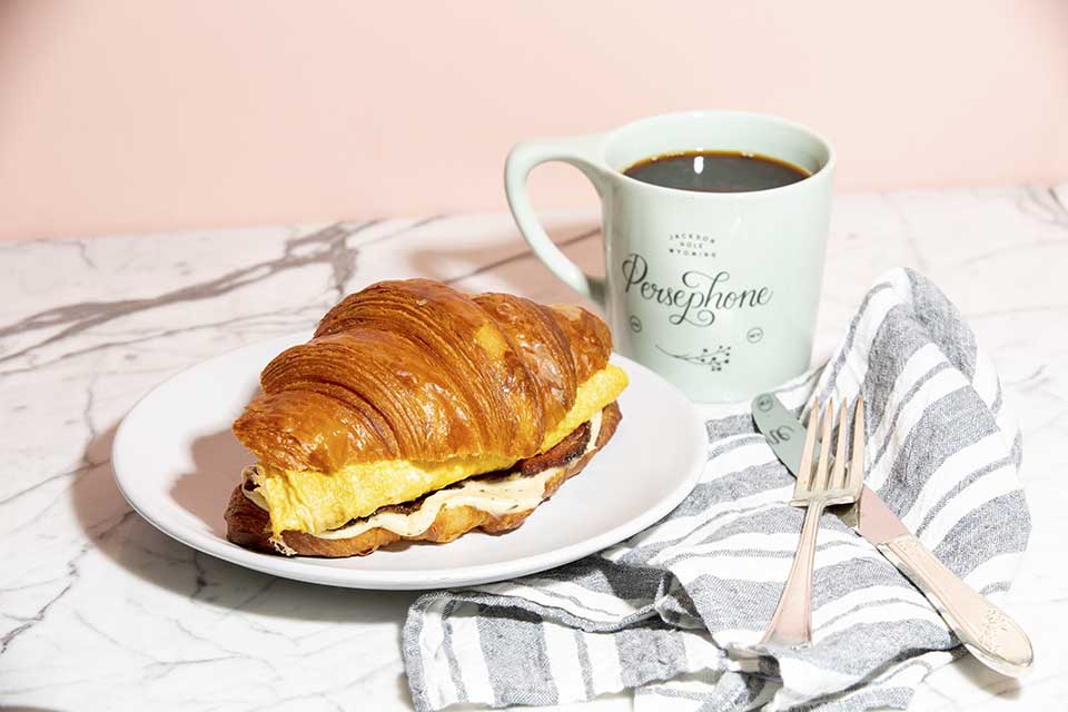 Persephone Bakery signature dishes Croissants, Kouign Amann, Seeded Avocado Bowl, Croque Madame