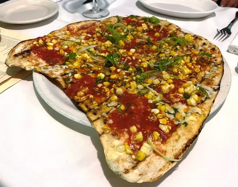 AL FORNO signature dishes Grilled Pizza, "Dirty Steak" with Hot Fanny Sauce, Clams Al Forno, Baked Pasta