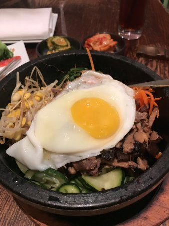 Mandu signature dishes Mandu (Dumplings), Bibimbap, Kimchi Jjigae, Korean Fried Chicken Wings