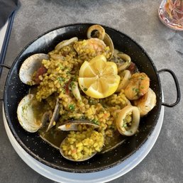 Gather signature dishes Paella, Mimosa, Crispy Brussel Sprouts.