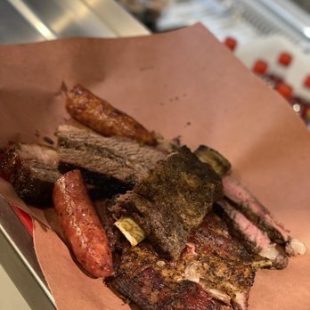 Cooper's Old Time Pit Bar-B-Que signature dishes Beef Ribs, Beef Brisket, Chopped Beef Sandwich.
