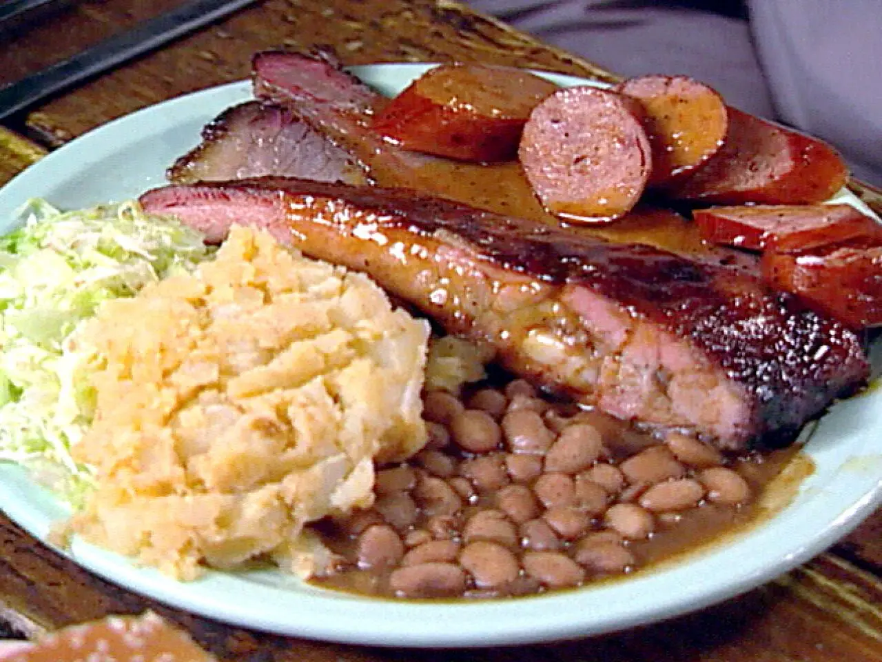 The Salt Lick BBQ signature dishes Brisket, Bison Ribs, Beef Ribs.