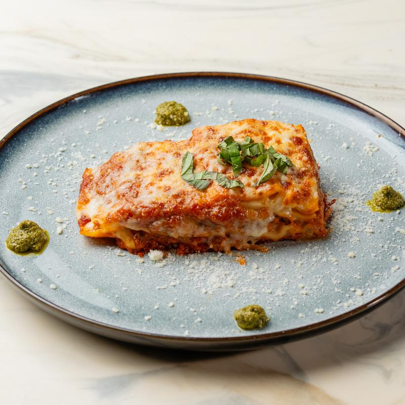 Dua Trattoria signature dishes Lasagna al FornoFettuccine AlfredoVeal Piccata