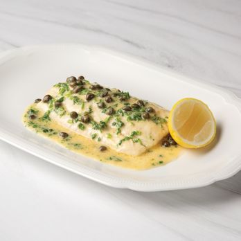 La Griglia signature dishes Veal ChopBranzinoPenne alla Vodka
