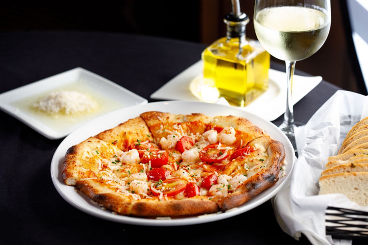Trezo Mare signature dishes Scallops RisottoWood-Fired SalmonMargherita Pizza