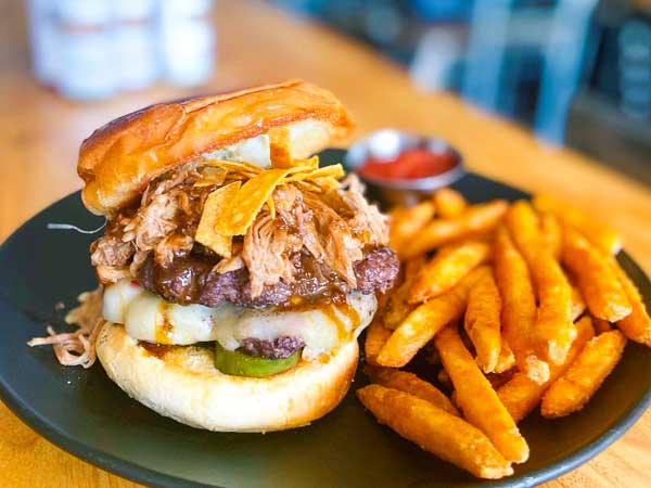 Henry’s signature dishes Henry's Classic BurgerFish and ChipsCajun Chicken PastaFrench Dip Sandwich