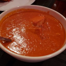 The Palace of Indian signature dishes Chicken Makhani (Butter Chicken)Shrimp VindalooPalak Paneer