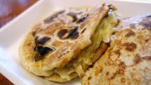 Tacos Chiwas signature dishes PastorQuesadillaLengua