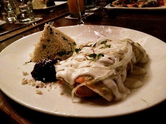Hugo's signature dishes EnchiladasChapulinesPescado en Mole Amarillo