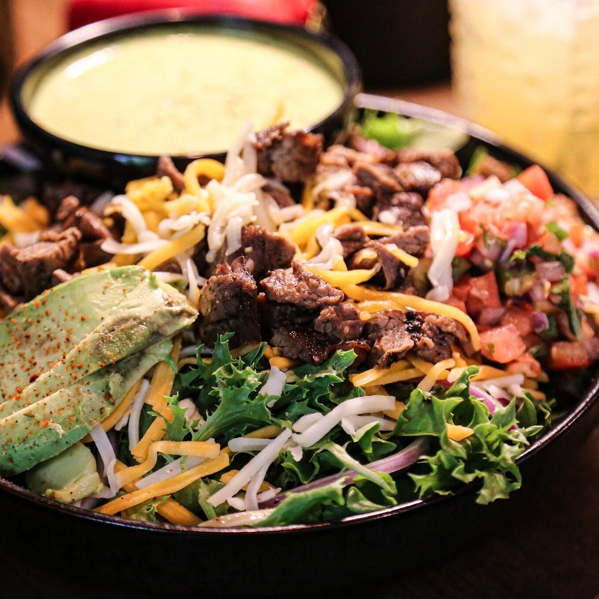 Tequila Chulos signature dishes FajitasChimichangaQueso Fundido