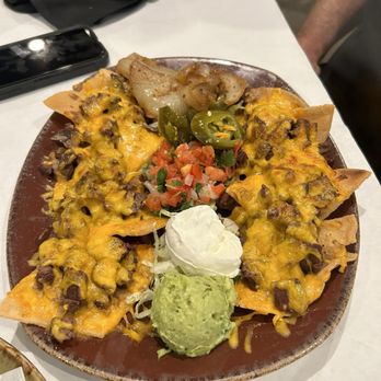 Tío Javi's Fresh-Mex Bar & Grill signature dishes Xochitl SoupTexas ComboNachos