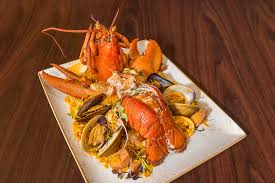 Los Andes signature dishes PaellaLomo SaltadoBisteca Andina