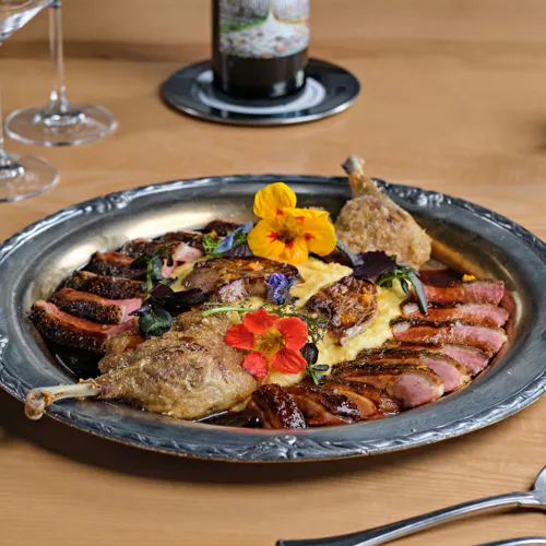 Rocca signature dishes Tableside Mozzarella (pulled by hand and served with heirloom tomatoes and 10-year aged balsamic), Spaghetti al Limone (with blue crab and zucchini), Raviolini del Plin, and Dry-Aged Rohan Duck.