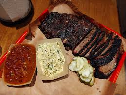 Palmira Barbecue signature dishes Brisket, Pulled Pork, Beef Ribs, House-made Sausages, Beef Cheeks, Pork Ribs