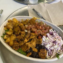 Guasaca South American Grill signature dishes Build-Your-Own Arepas, Bowls, and Salads with fillings like shredded beef, grilled chicken, or black beans. The namesake "Guasaca" sauce (an avocado-based salsa) is a key topping.