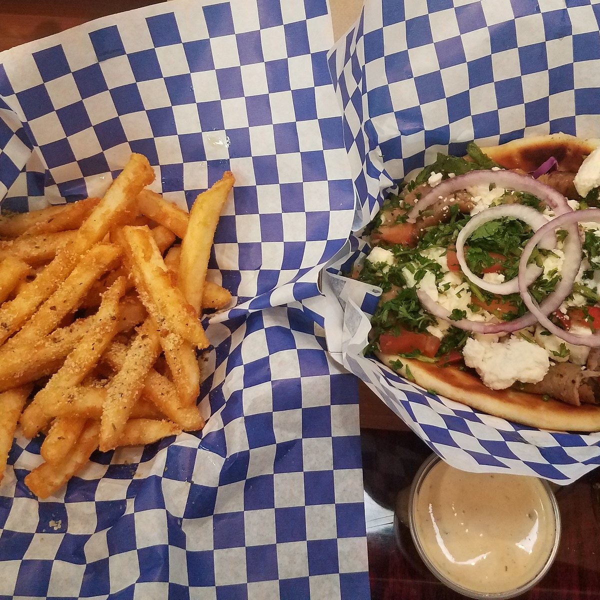 Mad Pita Express signature dishes Gyro, Chicken Souvlaki, Mad Pita Fries, Spanakopita